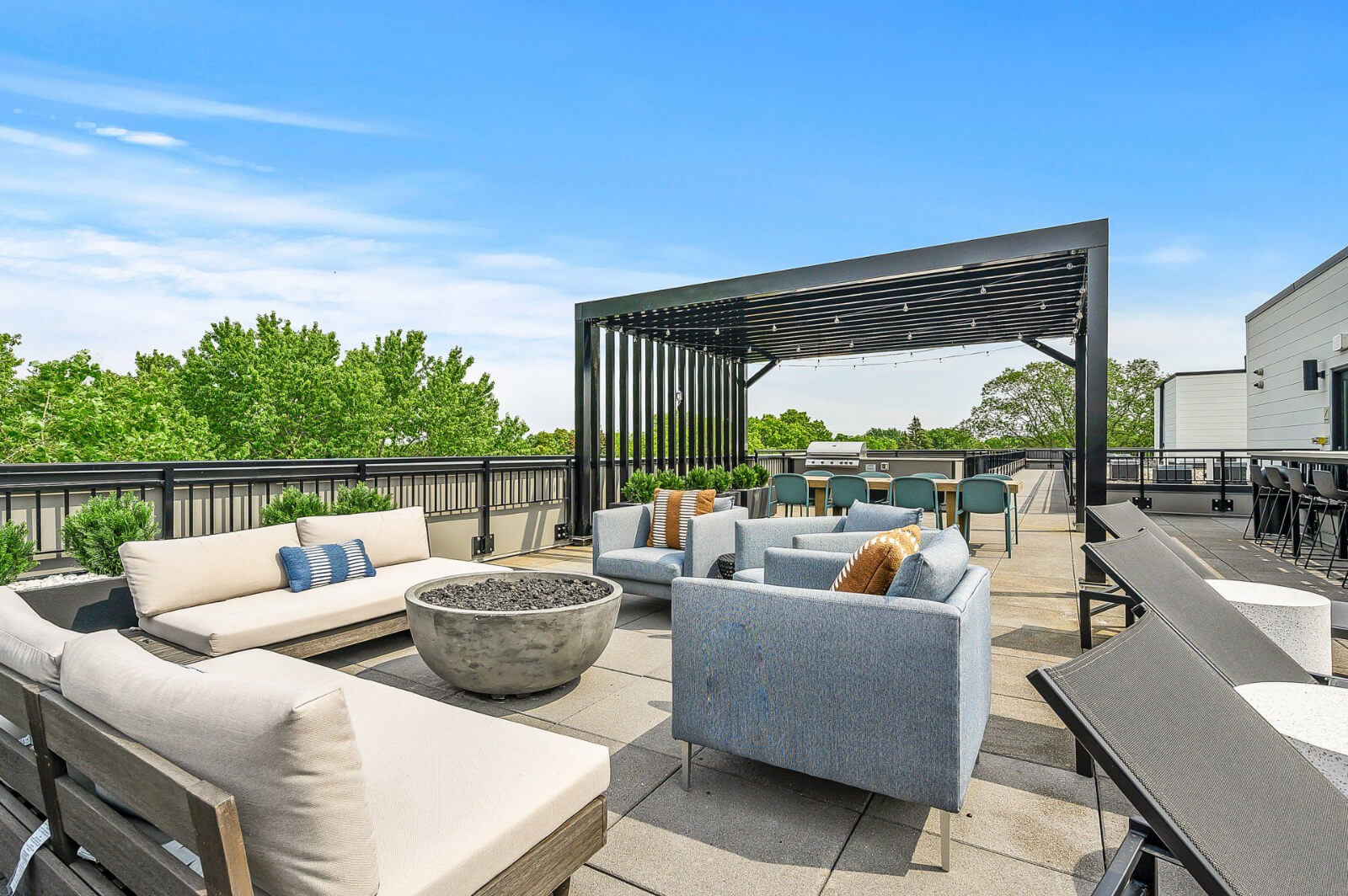 the community balcony with seating and a firepit